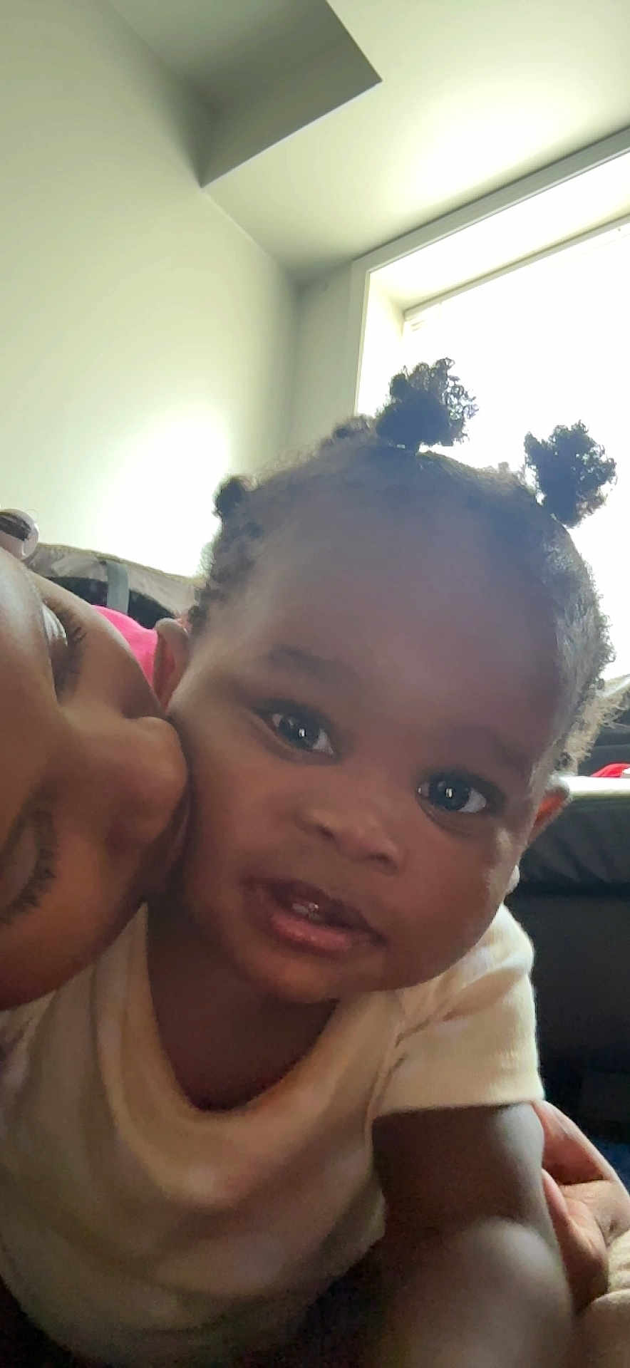Kayden joined the competition — help win amazing prizes! toddler, child, baby, person, face, smile, hair, puffs, kiss, affection, love, indoor, window, light, adult, close_up, skin, expression, cute, happy