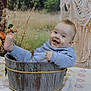 baby, bucket, blue_clothing, smiling, happy, flower_arrangement, wooden_bucket, macrame, indoor, portrait, child, cute, foot_up, tablecloth, floral_pattern, decor, cozy, infant, sitting, background