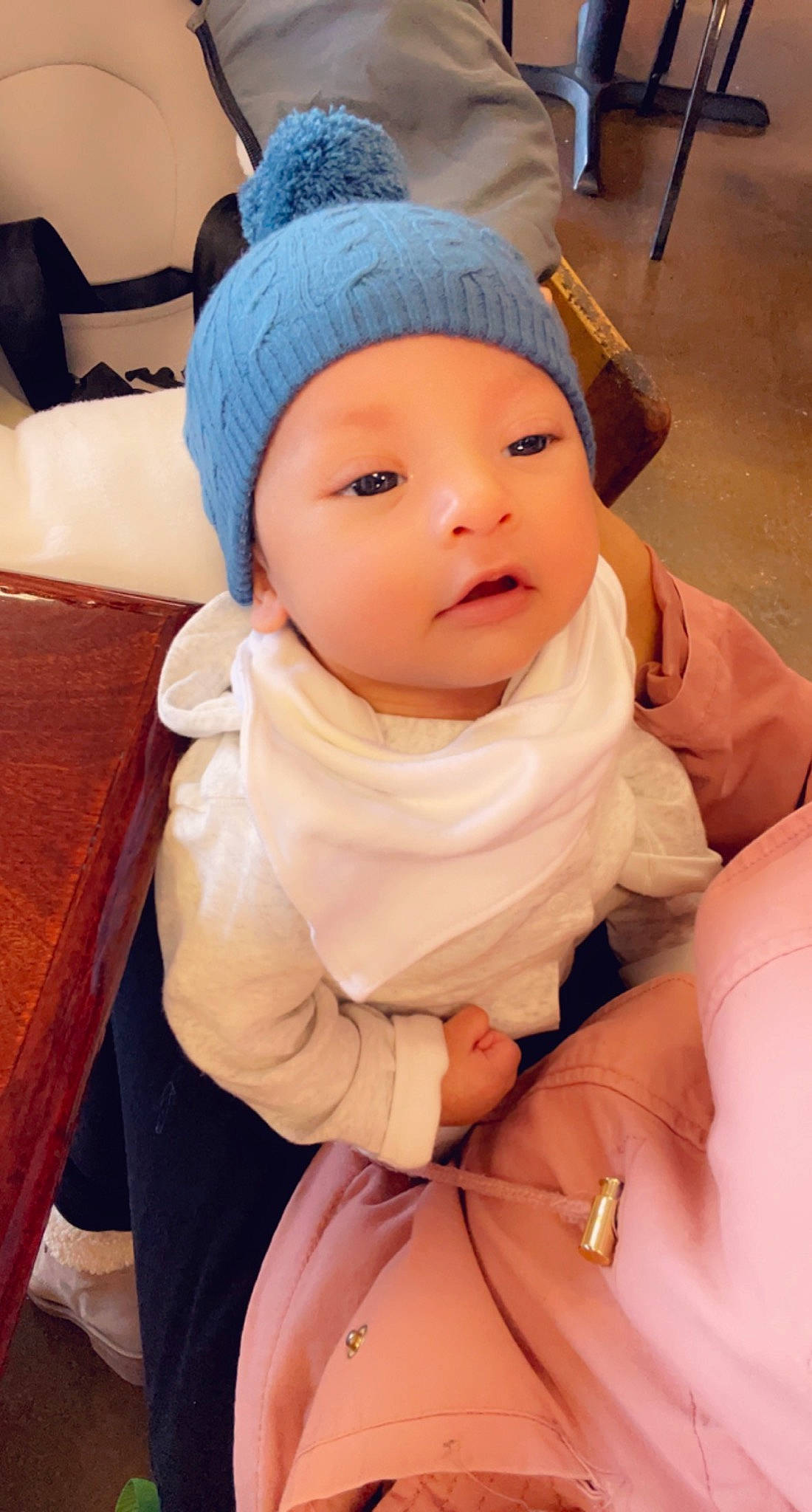 Emilio is registered to the contest to win money with this photo: baby, baby_toddler_clothing, cap, cheek, child, comfort, dress, eye, eyebrow, finger, gesture, happy, headwear, human_body, knit_cap, lip, nose, person, skin, sleeve