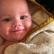 Leysso participe au concours pour gagner de l'argent avec cette photo : baby, smiling, face, closeup, towel, blanket, soft_texture, wrapped, infant, cute, skin, eyes, indoors, warm, comfort, child, happy, portrait, newborn, head