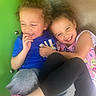 Aria is registered to the contest to win money with this photo: blue_shirt, candid, casual_clothing, child, children, closeup, curly_hair, friendship, fun, happy, hug, joy, leggings, outdoor, pink_shoes, play, playground, smile, toddler, young