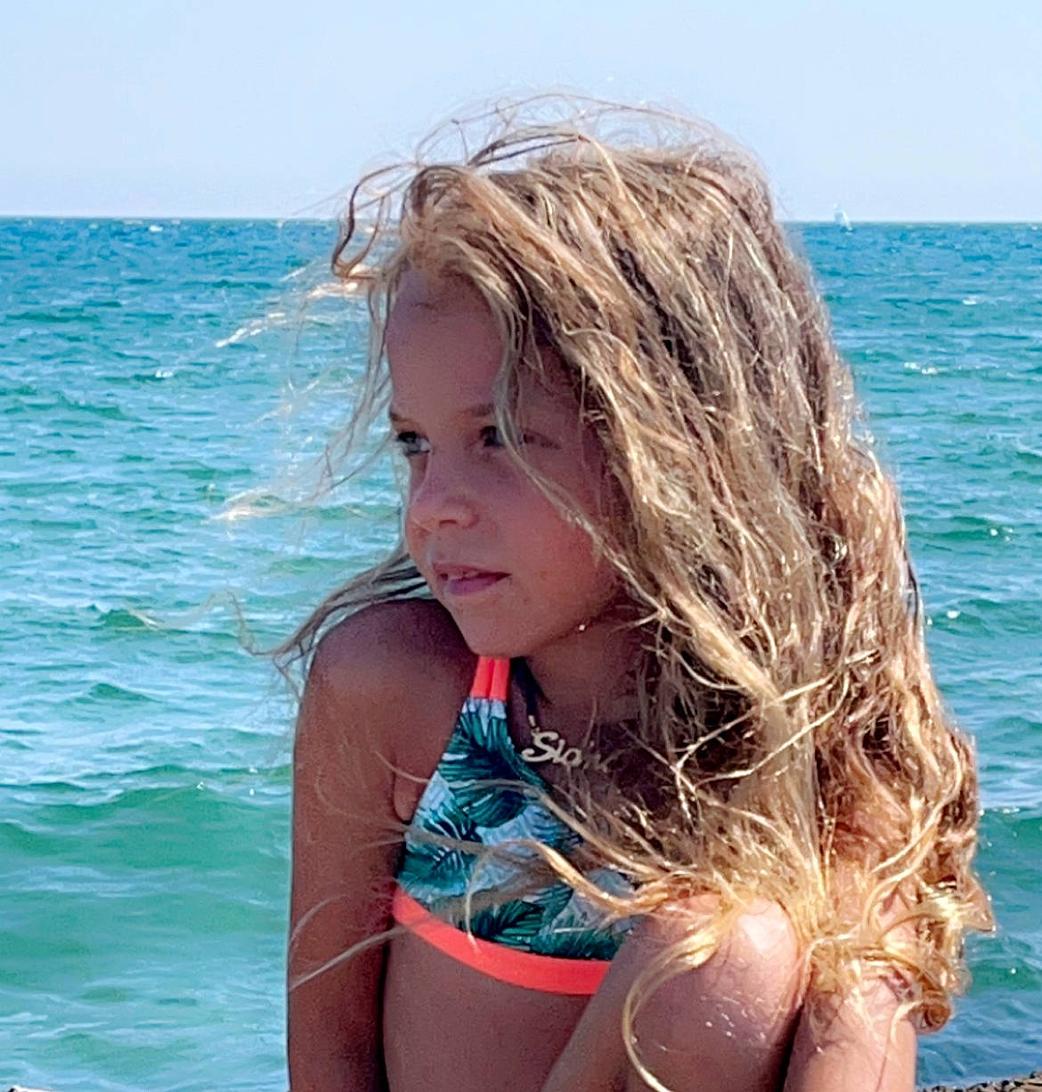 Siana participe au concours pour gagner de l'argent avec cette photo : beach, blond, brassiere, brown_hair, electric_blue, fun, happy, leisure, lingerie, lingerie_top, long_hair, ocean, people_in_nature, person, sky, surfer_hair, swimsuit_top, swimwear, thigh, undergarment