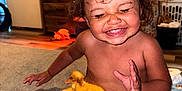Aaliyah joined the competition — help win amazing prizes! animal, baby, carpet, child, cute, diaper, duckling, expression, face, furniture, happy, home, indoor, pet, playing, sitting, smile, toddler, yellow_duck, young_child