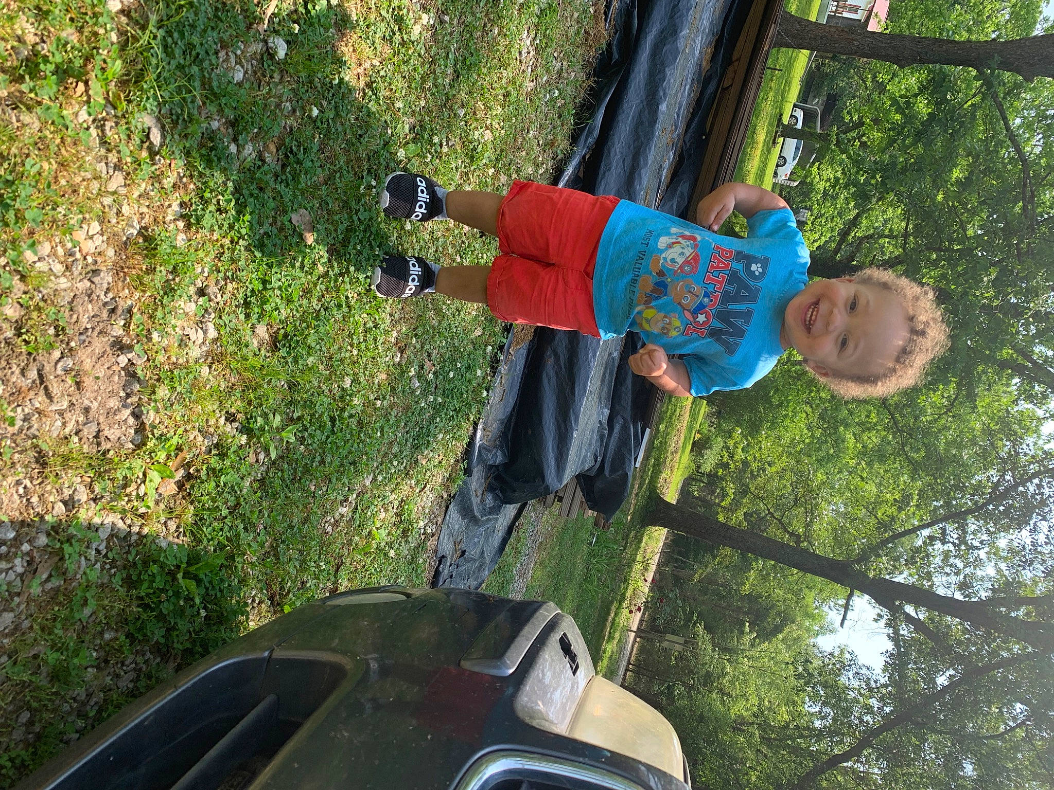 Kaiden is registered to the contest to win money with this photo: automotive_exterior, automotive_lighting, automotive_tire, automotive_window_part, bumper, car, family_car, fun, grass, hood, joy, leaf, leisure, motor_vehicle, person, plant, tints_and_shades, tree, vehicle, vehicle_door