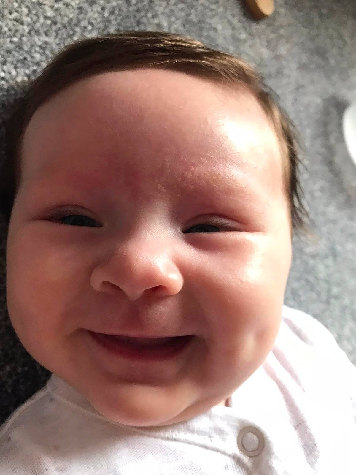 Erin is registered to the contest to win money with this photo: baby, baby_toddler_clothing, cheek, ear, eyebrow, eyelash, forehead, fun, happy, iris, jaw, joy, lip, mouth, neck, nose, person, skin, smile, toddler