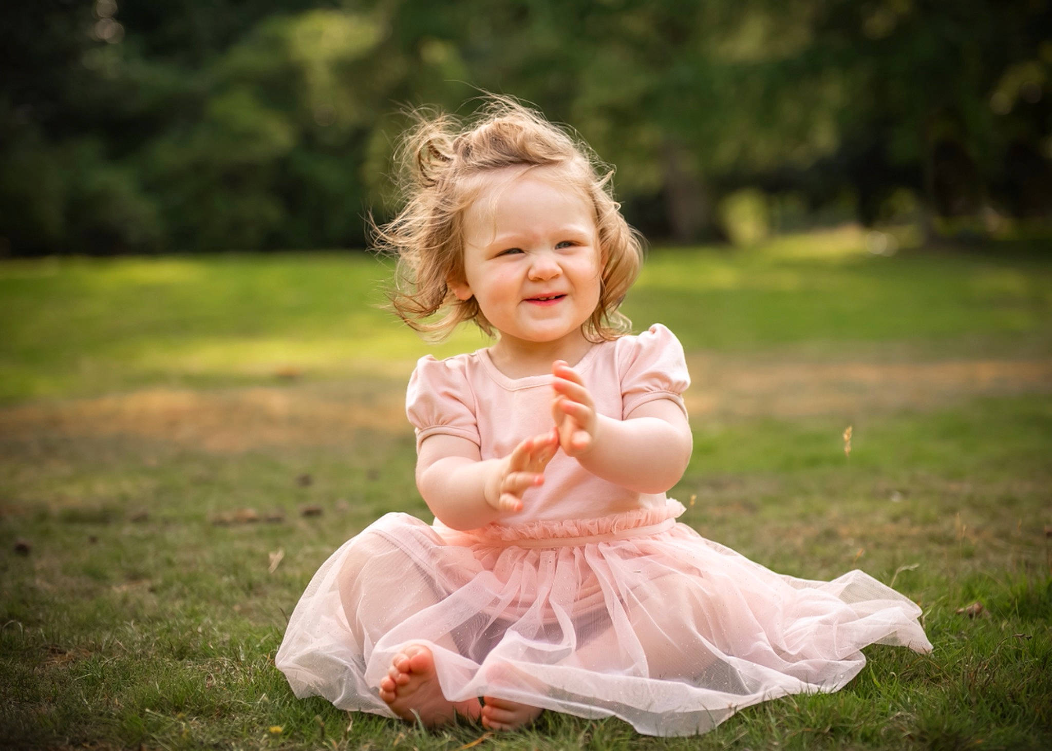 Erin is registered to the contest to win money with this photo: baby, baby_toddler_clothing, child, dress, eye, face, facial_expression, flash_photography, fun, grass, happy, joy, leaf, meadow, people_in_nature, person, plant, smile, summer, sunlight