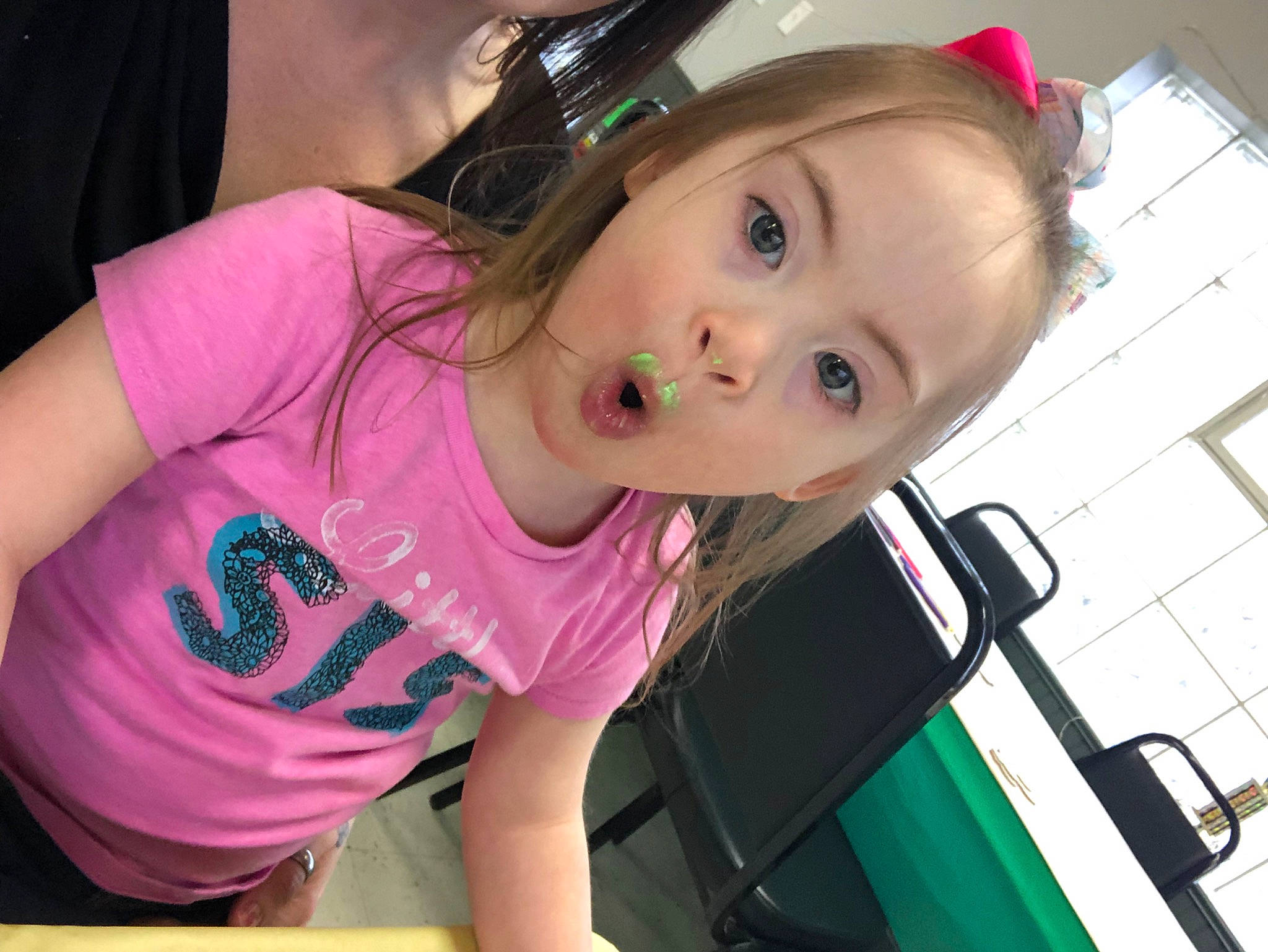 Frankie is registered to the contest to win money with this photo: baby_toddler_clothing, cheek, child, cool, eyelash, fashion_accessory, fun, happy, leisure, lip, magenta, mouth, nose, person, pink, sitting, skin, sleeve, surprise, t_shirt