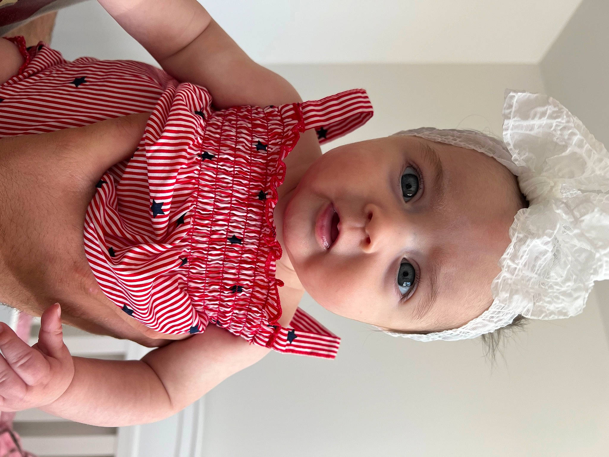 Tenley is registered to the contest to win money with this photo: baby, cheek, dress, eye, eyelash, facial_expression, gesture, hand, happy, head, iris, lip, mouth, neck, nose, person, pink, product, skin, toddler