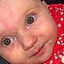 baby, close_up, face, brown_eyes, red_clothing, floral_pattern, smile, infant, skin, cute, sparkle_overlay, heart_overlay, portrait, child, young, adorable, expression, head, eyelashes, pink_skin
