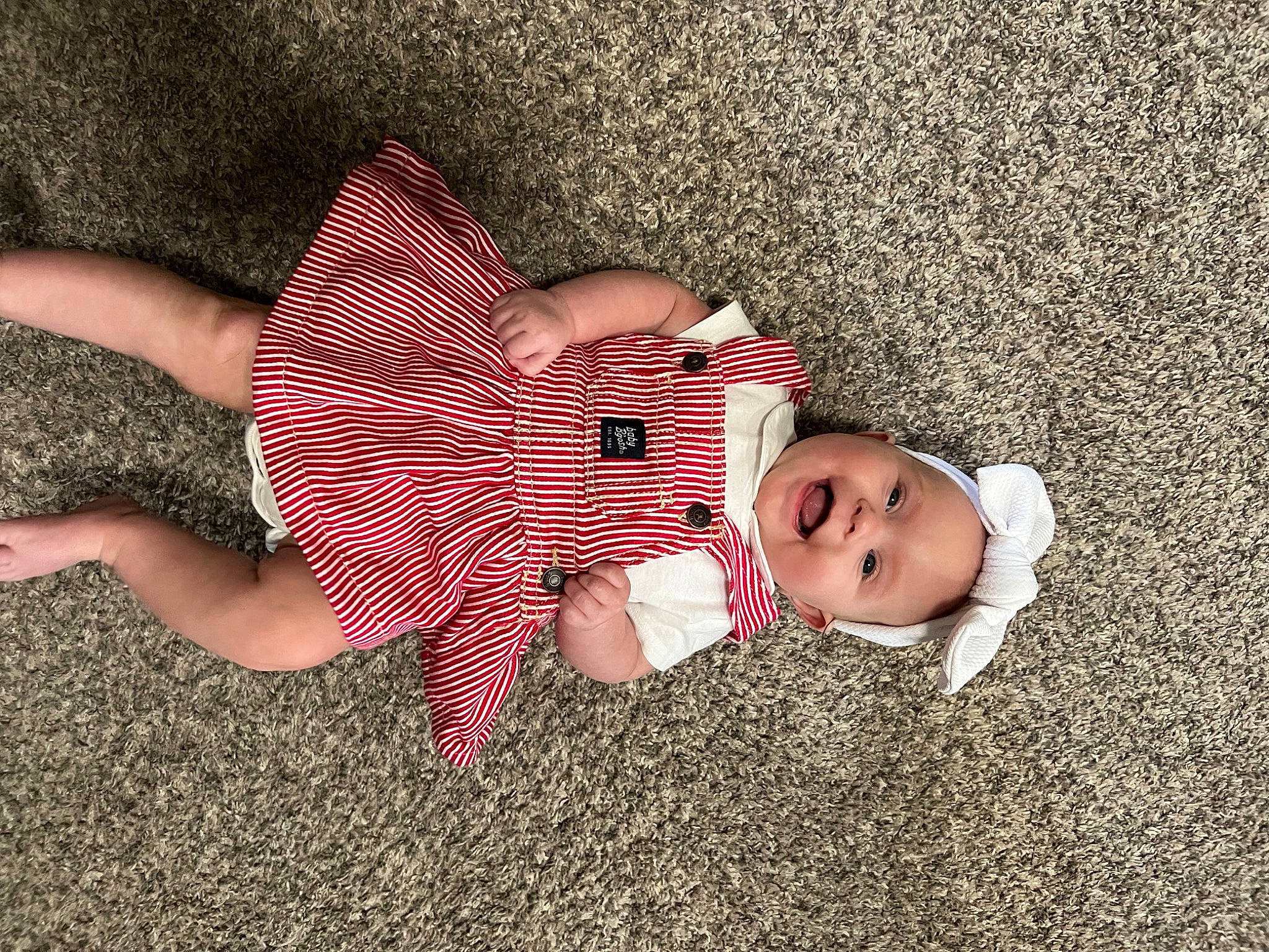 Ellie is registered to the contest to win money with this photo: baby, baby_toddler_clothing, beauty, child, comfort, finger, foot, fun, grass, hand, hat, human_body, human_leg, leg, nail, pattern, person, skin, thigh, thumb