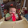 Tevy joined the competition — help win amazing prizes! toddler, child, high_chair, bottle, curly_hair, indoor, snacks, feeding, kitchen, sitting, happy, baby, red_bottle, cosco, tray, face, person, furniture, curly, playful
