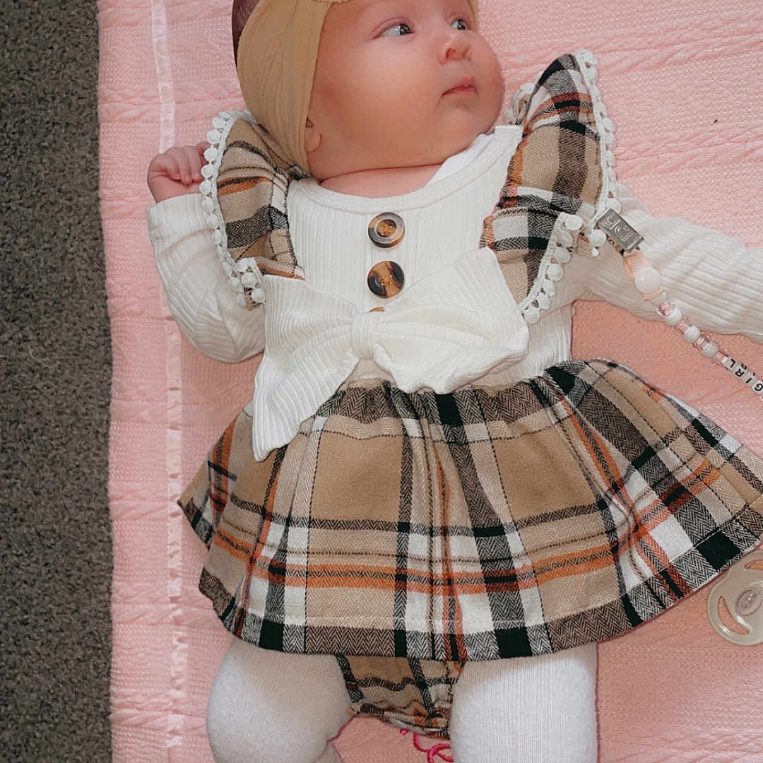 Caliana-Leigh is registered to the contest to win money with this photo: baby, bonnet, clothing, costume, cushion, doll, dress, face, furniture, hat, head, homedecor, hosiery, person, photography, portrait, skirt, sock, tartan, toy