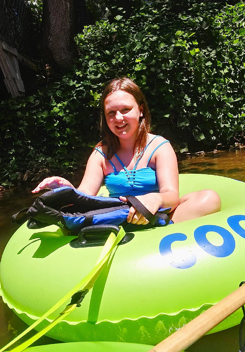 Lyndsey joined the competition — help win amazing prizes! boating, fun, games, grass, green, inflatable, joy, leisure, person, plant, recreation, sitting, smile, summer, tree, tubing, vacation, vehicle