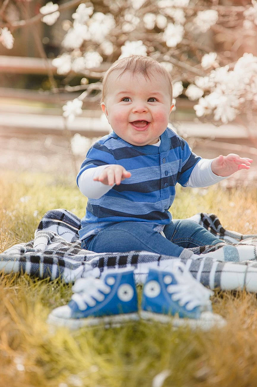 Camryn joined the competition — help win amazing prizes! baby, baby_toddler_clothing, child, electric_blue, face, fun, grass, happy, leisure, pattern, people, people_in_nature, person, product, recreation, sitting, smile, soil, spring, t_shirt