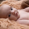 baby, blanket, child, closeup, cozy, cute, expression, eyes, face, indoors, infant, lying_down, natural_light, newborn, peaceful, portrait, resting, skin, soft_texture, warm