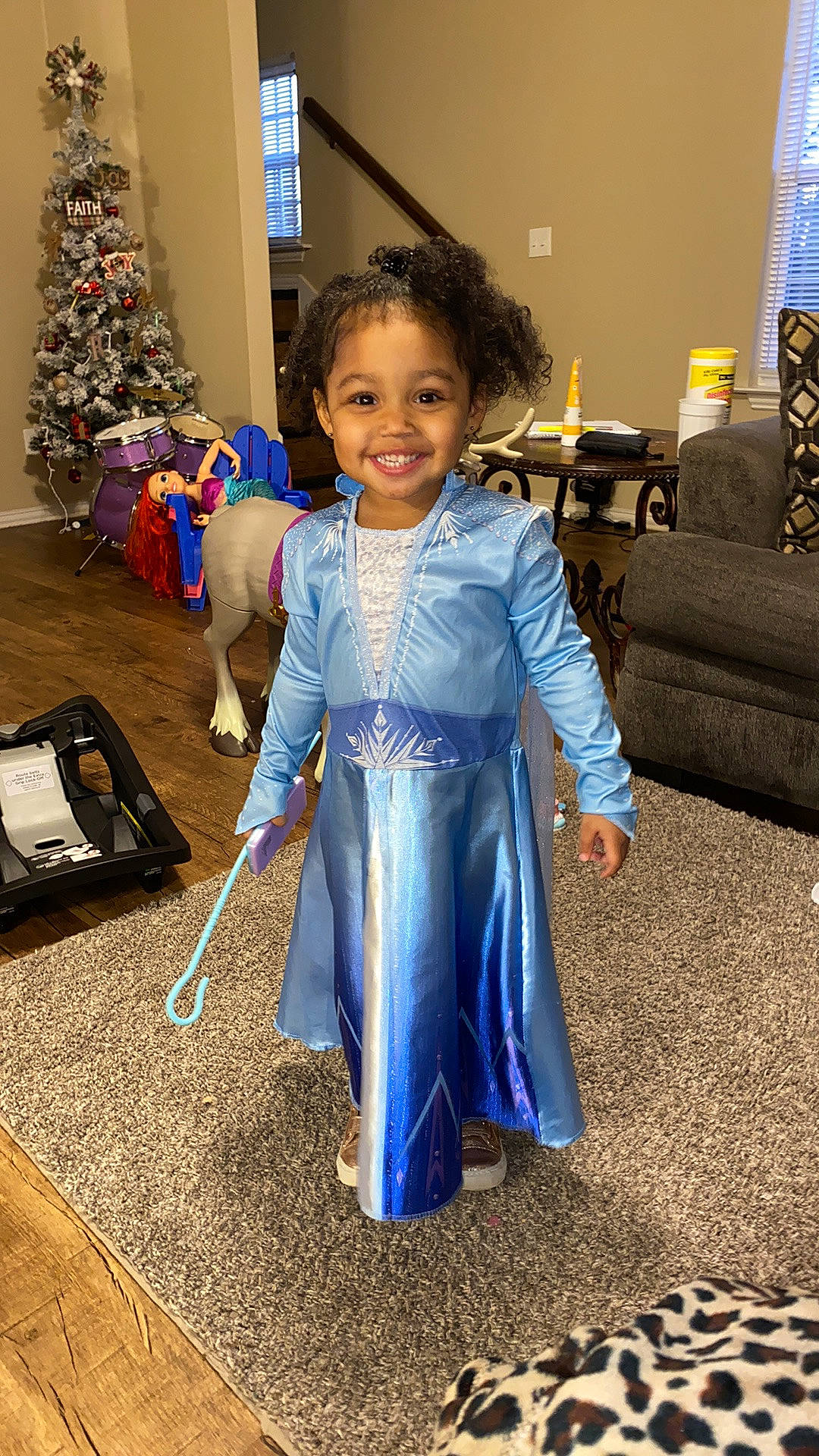 Amiyah is registered to the contest to win money with this photo: child, christmas, costume, dress, event, holiday, joy, outerwear, person, smile, toddler
