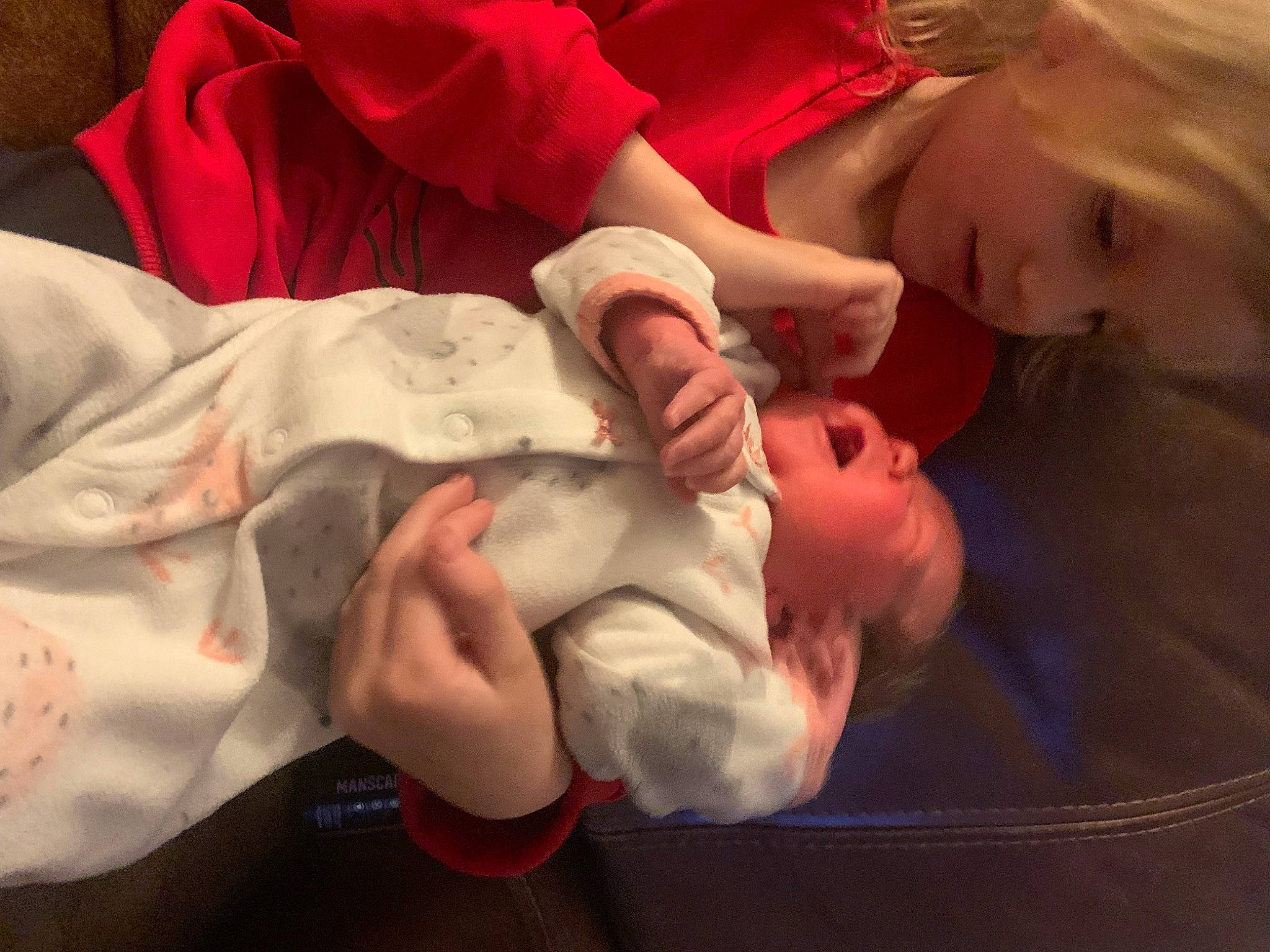 Addi is registered to the contest to win money with this photo: baby, baby_toddler_clothing, cheek, child, comfort, event, facial_expression, finger, fun, gesture, hair, hand, happy, mouth, nail, nose, person, room, thumb, toddler