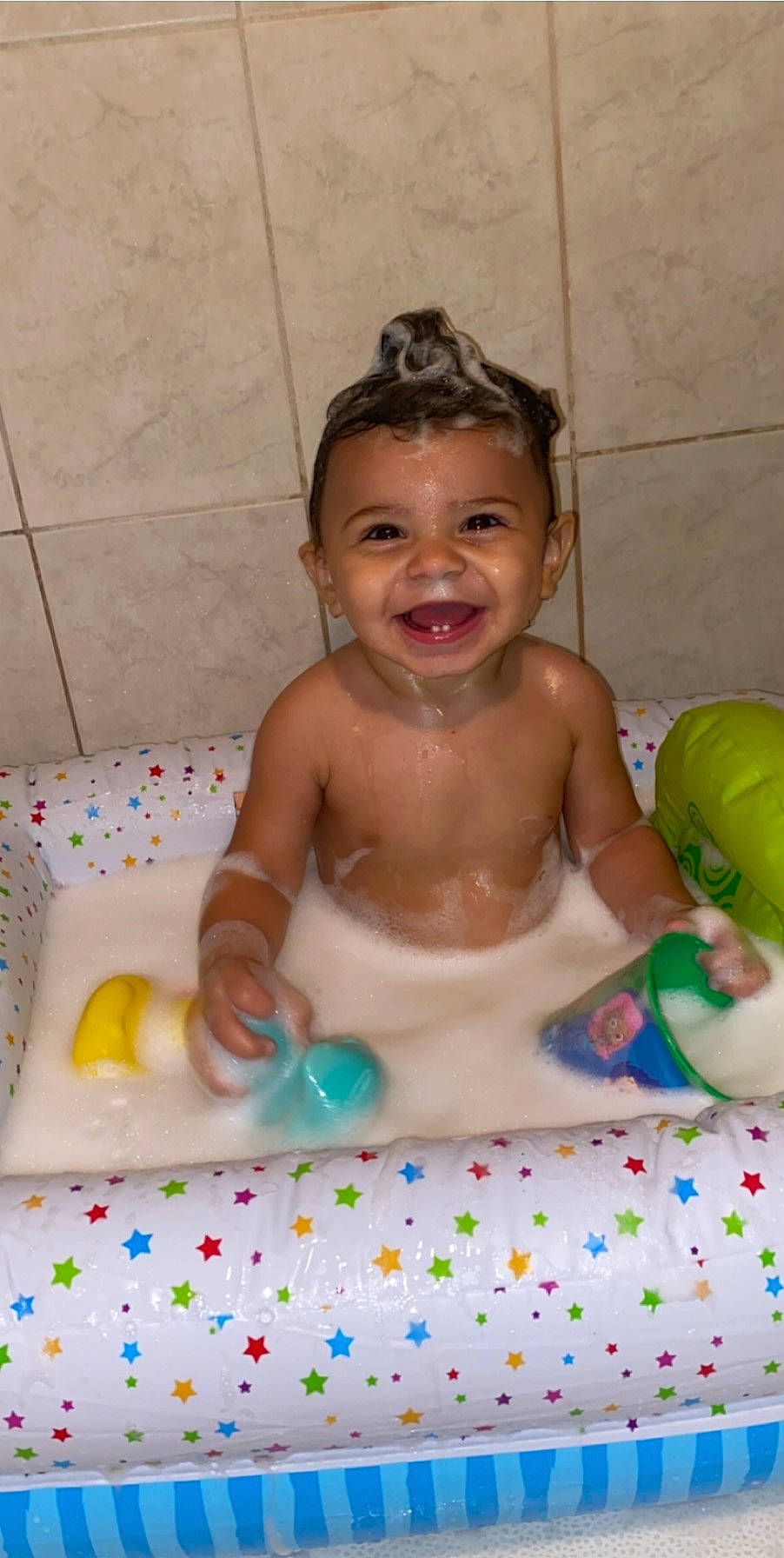 Chad is registered to the contest to win money with this photo: baby, baby_bathing, bathing, bathtub, child, joy, person, personal_care, toddler