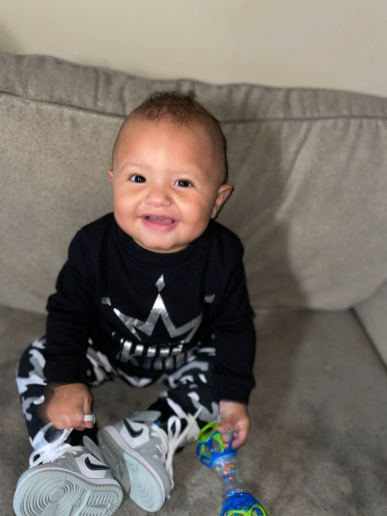 Kamdyn joined the competition — help win amazing prizes! arm, baby, baby_toddler_clothing, cheek, child, comfort, electric_blue, flooring, happy, joy, leg, pattern, person, sitting, skin, sleeve, smile, sock, t_shirt, toddler