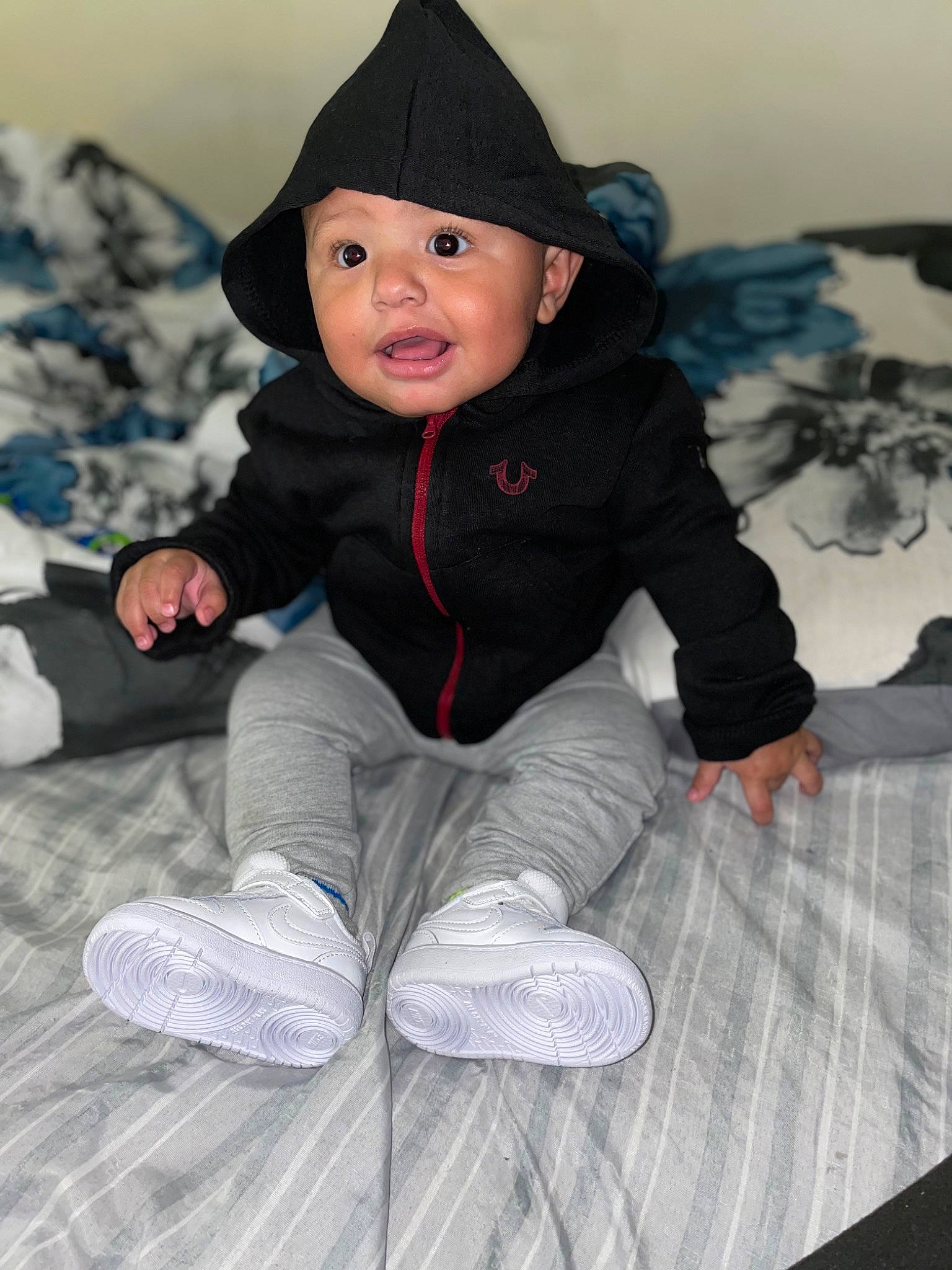 Kamdyn joined the competition — help win amazing prizes! baby, baby_toddler_clothing, black, cap, cheek, child, comfort, face, happy, headgear, headwear, outerwear, people, person, photograph, sitting, sleeve, smile, surprise, toddler