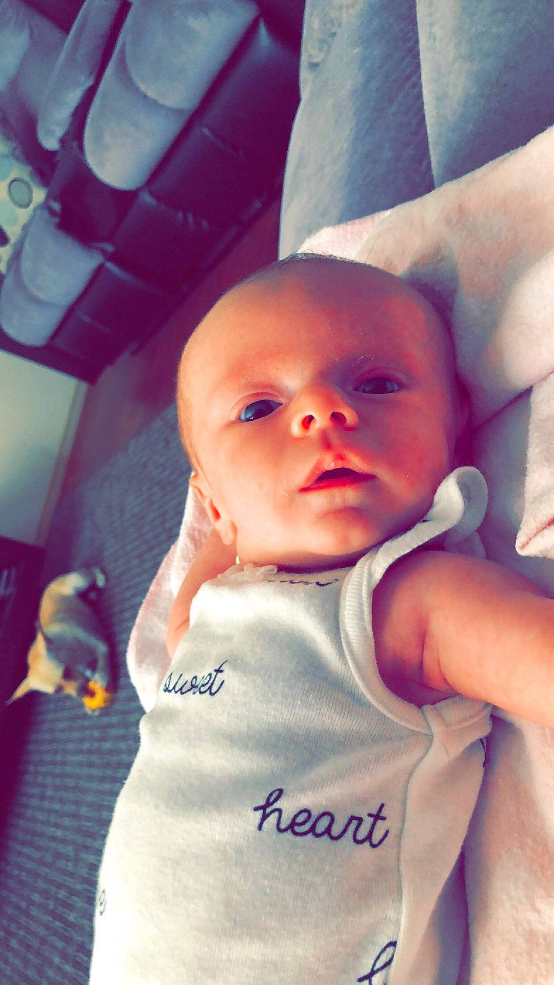 Raegan is registered to the contest to win money with this photo: arm, boy, cheek, child, cool, eye, finger, girl, hand, head, human, infant, organ, person, pink, product, purple, skin, smile, toddler