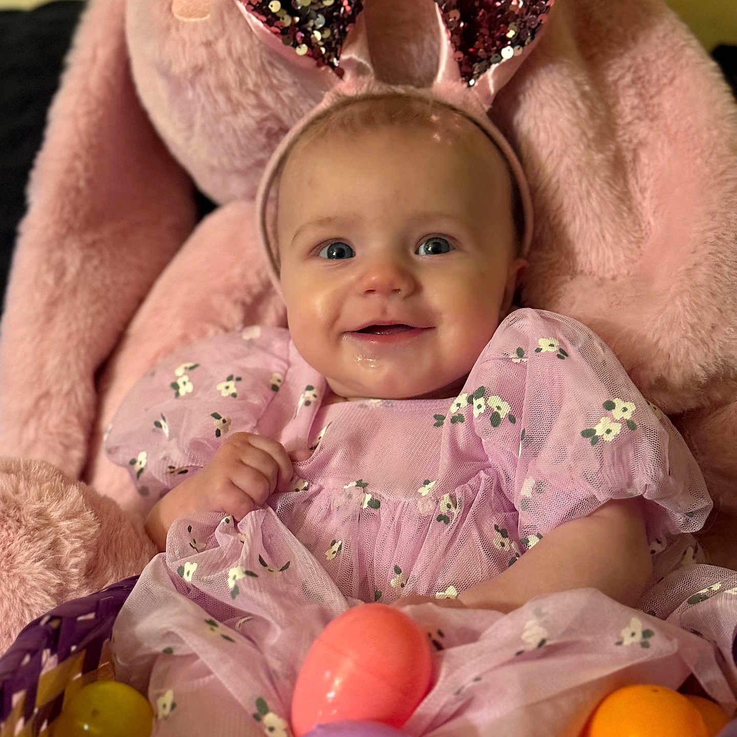 Braelyn is registered to the contest to win money with this photo: baby, balloon, basket, bodypart, couch, face, finger, furniture, hand, happy, head, homedecor, newborn, person, photography, portrait, purple, sitting, smile, toy