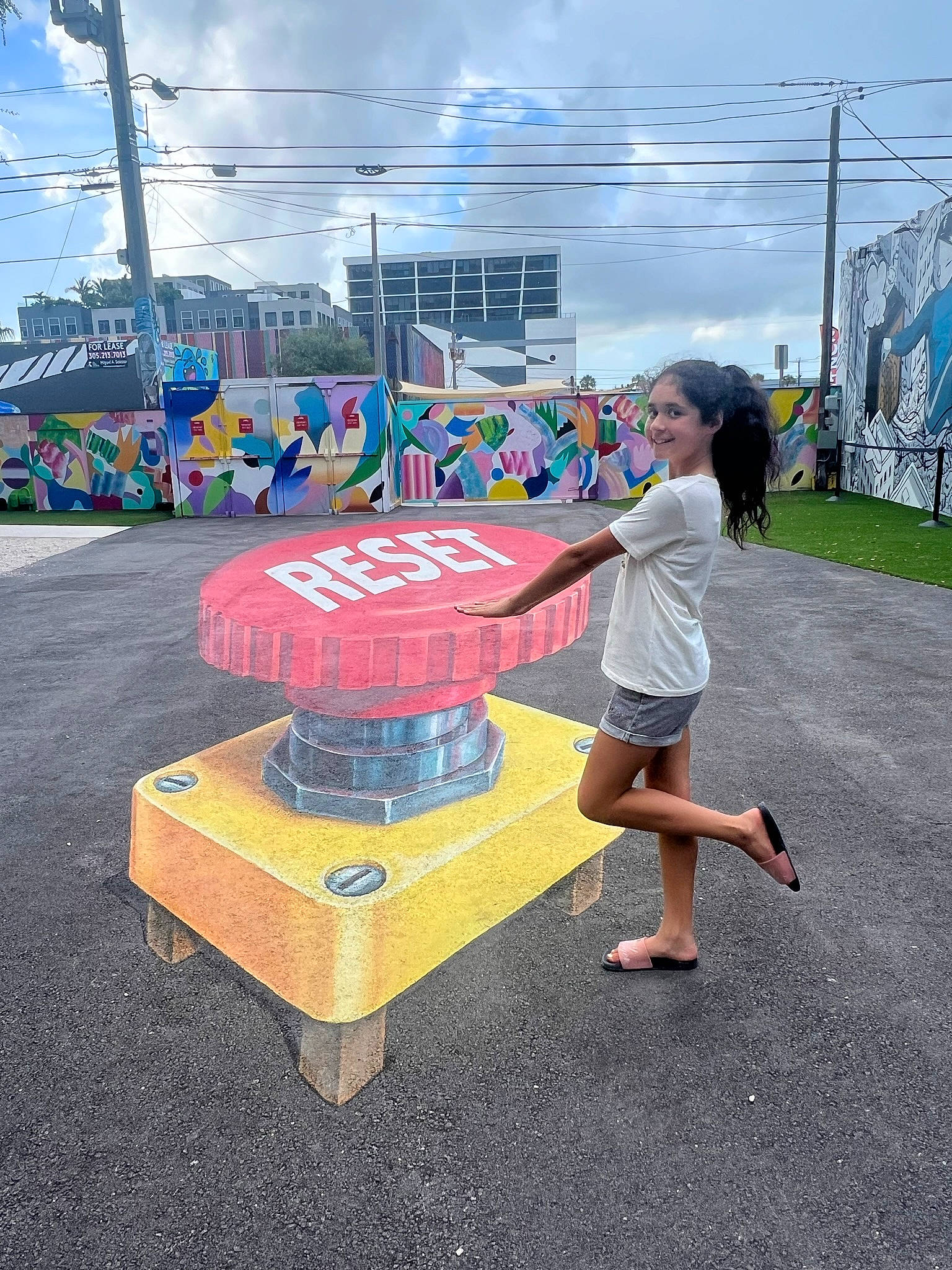 Aliya is registered to the contest to win money with this photo: advertising, asphalt, city, cloud, electric_blue, entertainment, event, flooring, fun, games, joy, leisure, party_supply, person, plant, play, recreation, shorts, sky, t_shirt