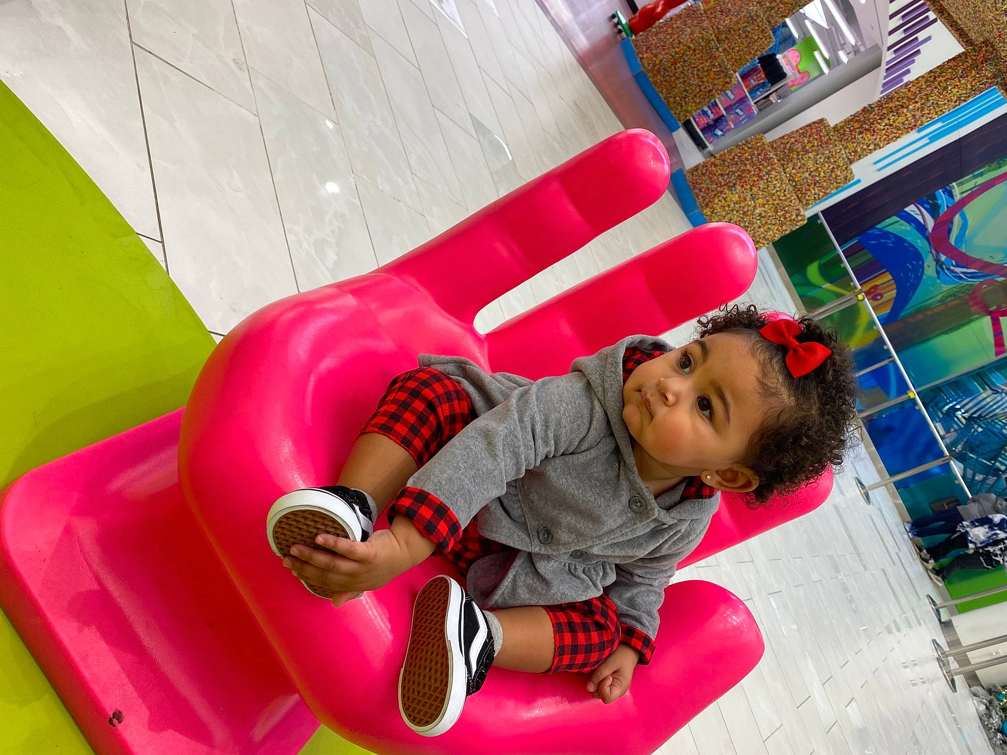 Mackenzie is registered to the contest to win money with this photo: baby_toddler_clothing, child, chute, city, comfort, flooring, fun, grass, happy, leisure, magenta, outdoor_play_equipment, person, pink, play, playground, recreation, room, sitting, smile