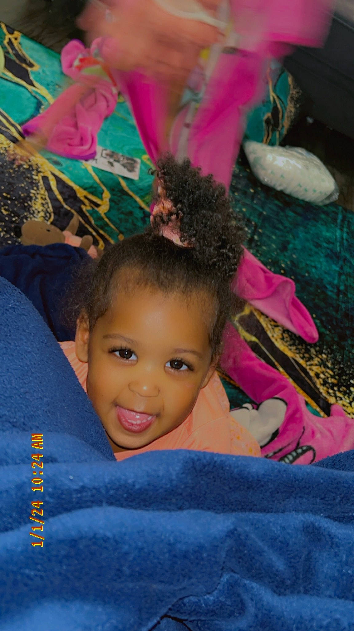 Maryann is registered to the contest to win money with this photo: baby, black_hair, cheek, child, eyebrow, eyelash, fashion_accessory, flash_photography, fun, hair_accessory, happy, head, headpiece, joy, leisure, magenta, person, petal, pink, sitting