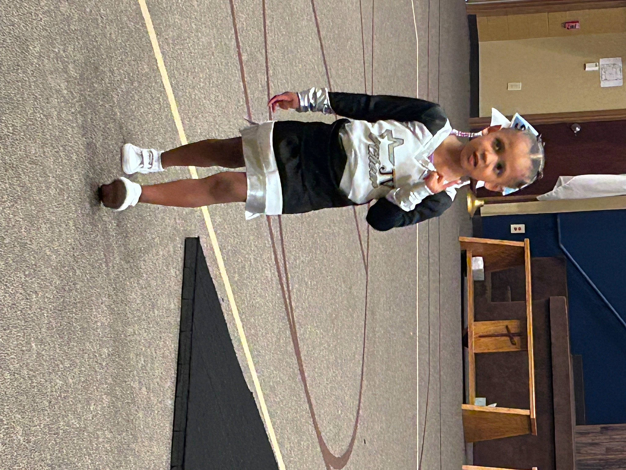 Tanji is registered to the contest to win money with this photo: asphalt, balance, elbow, event, human_leg, outdoor_shoe, person, recreation, shadow, walking_shoe, wood