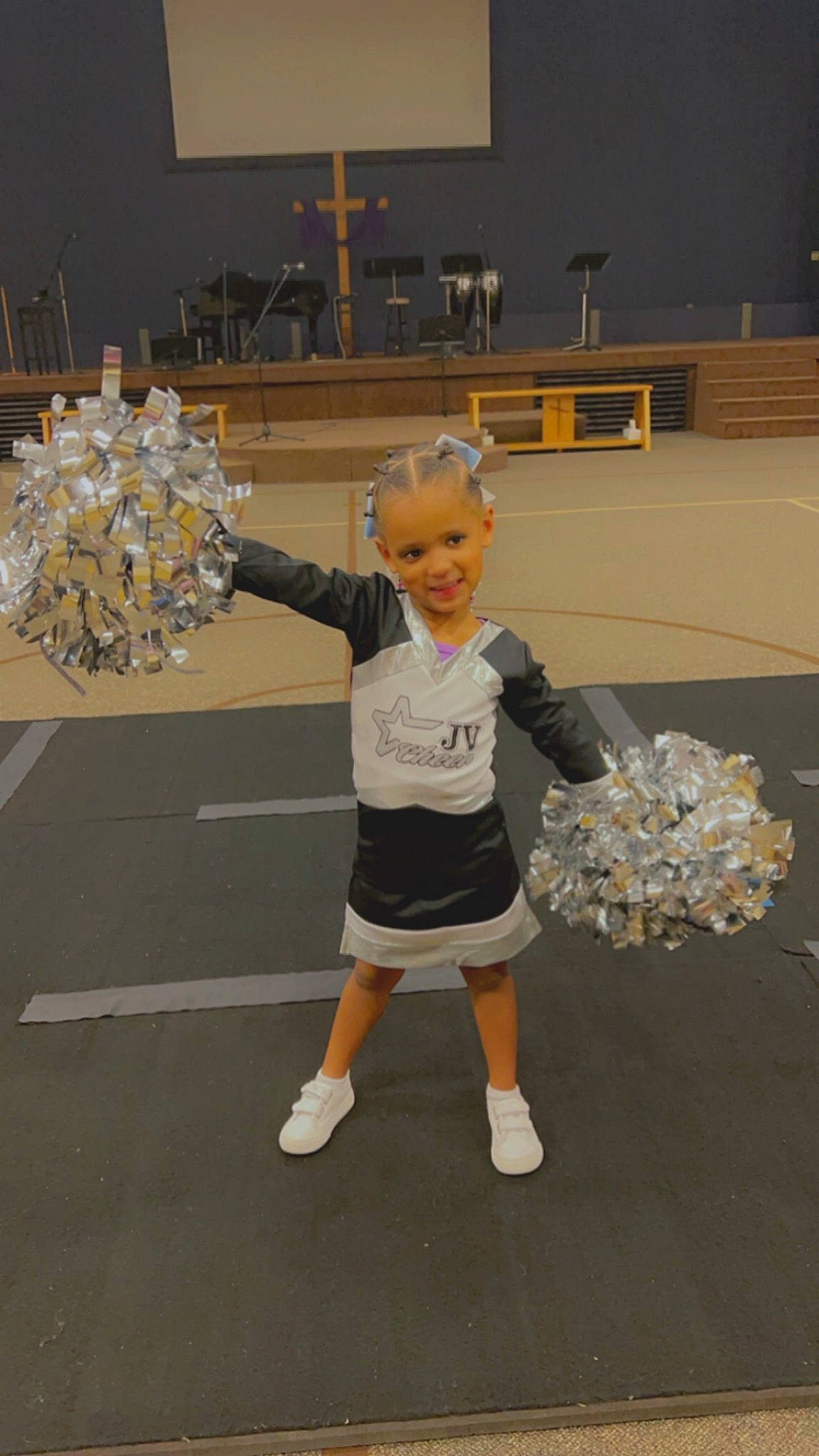 Tanji joined the competition — help win amazing prizes! cheerleading, cheerleading_uniform, competition_event, dance, flooring, fun, gesture, human_leg, joy, person, player, pom_pom, recreation, room, sports, sports_uniform, sportswear, t_shirt, team_sport, thigh