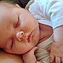 Delaney is registered to the contest to win money with this photo: baby, sleeping, blanket, knitted, infant, peaceful, child, portrait, closeup, face, hand, cozy, white_clothing, skin, rest, soft, cute, newborn, relaxation, warm