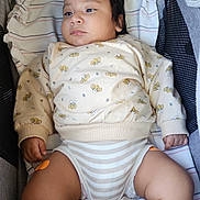 Erling joined the competition — help win amazing prizes! baby, infant, child, bassinet, blanket, clothing, sweatshirt, striped, cute, chubby, legs, hands, face, indoors, resting, looking_away, soft_lighting, fabric, comfort, toddler