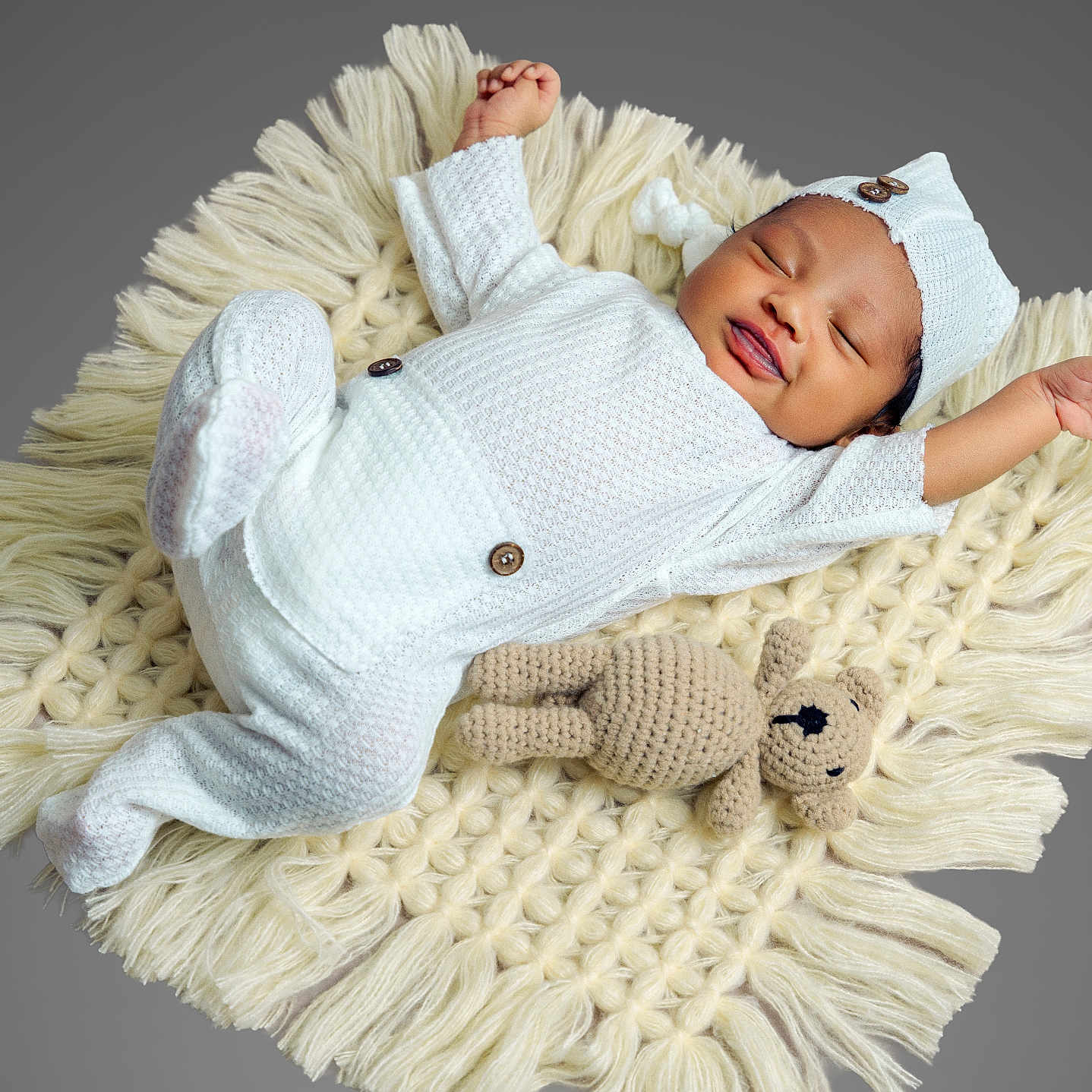 Zarah is registered to the contest to win money with this photo: adorable, baby, child, cozy, crocheted_toy, cute, headwear, indoor, infant, knitted_blanket, lying_down, newborn, peaceful, portrait, sleeping, smiling, soft_texture, teddy_bear, warm, white_outfit