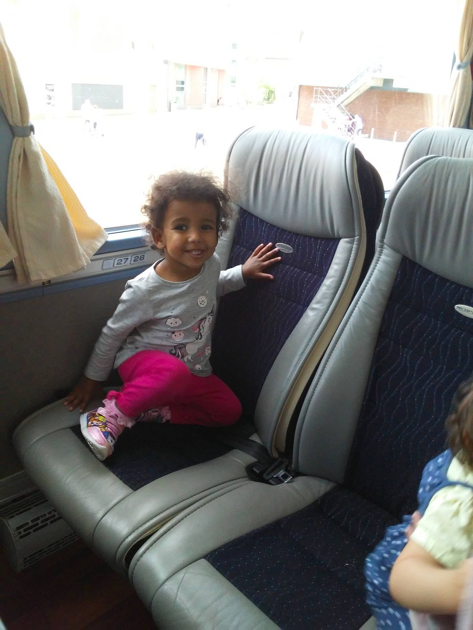 Jazmin is registered to the contest to win money with this photo: auto_part, car, car_seat, car_seat_cover, child, family_car, joy, leisure, luxury_vehicle, passenger, person, vacation, vehicle