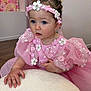 Mia.r participe au concours pour gagner de l'argent avec cette photo : child, baby, toddler, pink_dress, headband, blue_eyes, portrait, indoor, floral, lace, tulle, jewelry, necklace, bracelet, hand, curly_hair, sparkle, seated, soft_fabric, flower_decor
