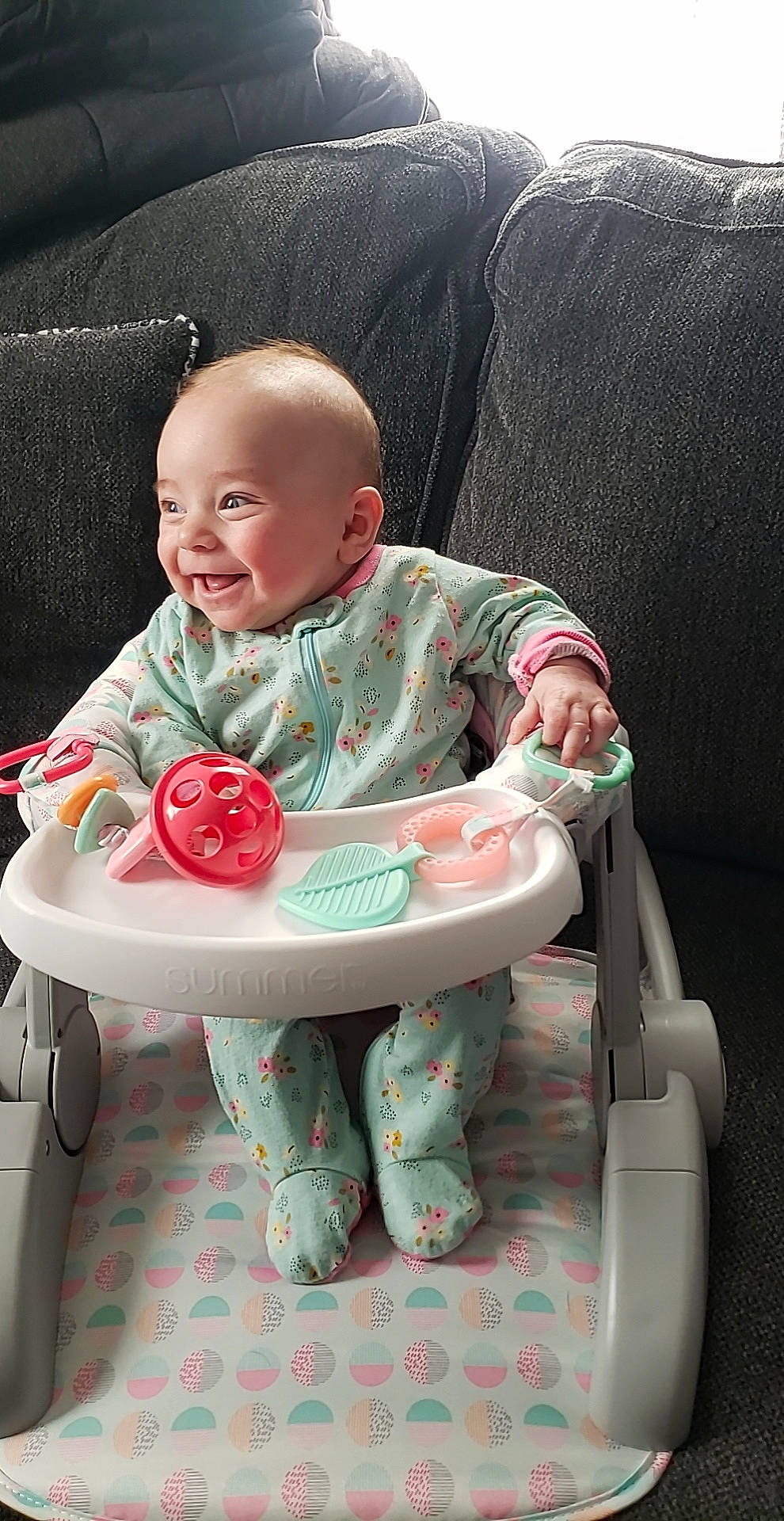 Jocelyn is registered to the contest to win money with this photo: baby, baby_carriage, baby_products, baby_safety, baby_toddler_clothing, baby_toys, carmine, child, comfort, face, fun, happy, lap, person, pink, play, sitting, sleeve, smile, sock