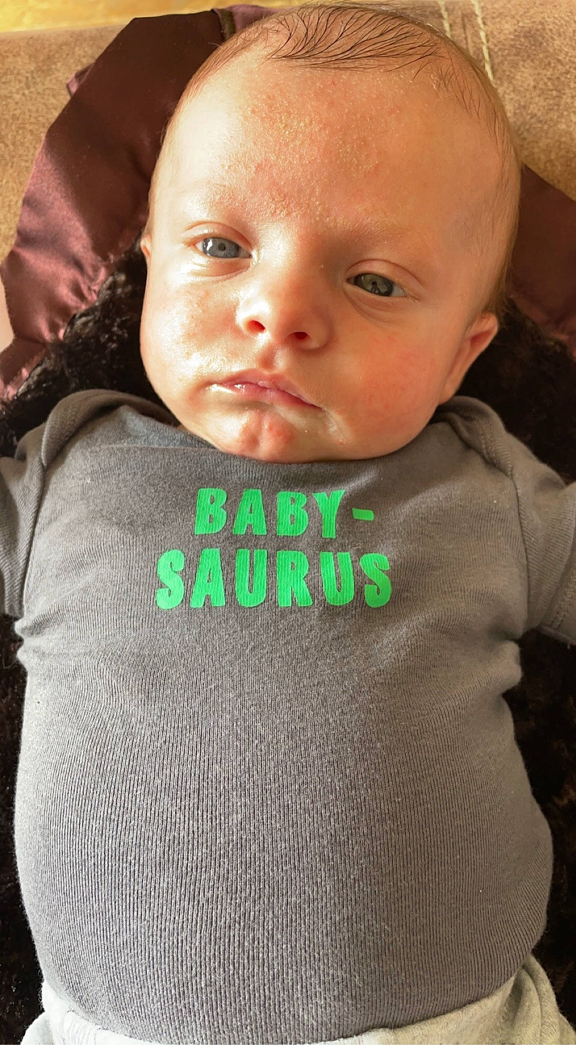 Lincoln is registered to the contest to win money with this photo: baby, baby_toddler_clothing, beard, cheek, eyebrow, eyelash, face, forehead, grey, hairstyle, head, human, lip, mouth, neck, nose, outerwear, person, skin, sleeve