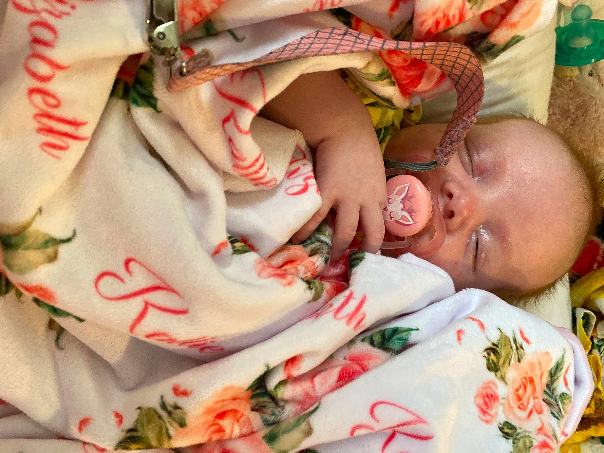 Kallie joined the competition — help win amazing prizes! baby, child, close_up, comfort, eye, facial_expression, finger, grass, green, hand, happy, head, human_leg, linens, lip, mouth, nail, person, skin, toddler