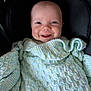 Archie is registered to the contest to win money with this photo: baby, smiling, blanket, knitted, cozy, car_seat, infant, happy, face, child, portrait, cute, comfort, warmth, clothing, seatbelt, closeup, expression, young, head