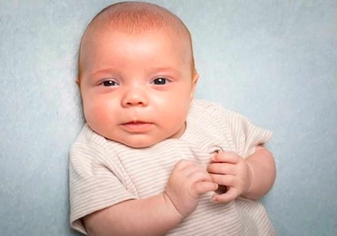 Archie joined the competition — help win amazing prizes! baby, infant, child, face, hands, clothing, onesie, portrait, closeup, cute, skin, expression, newborn, person, head, young, human, background, soft, curious