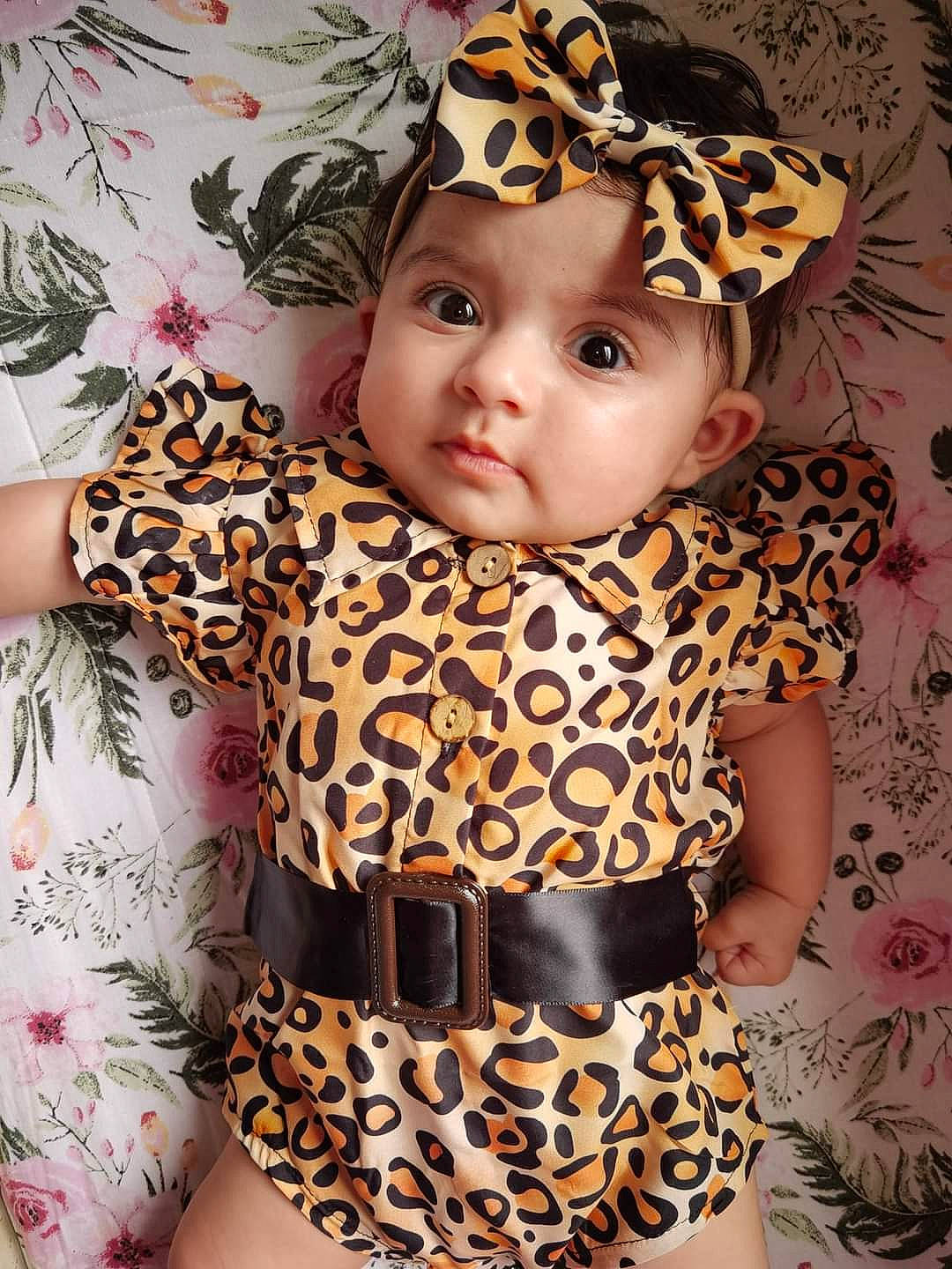 Stella is registered to the contest to win money with this photo: baby, baby_toddler_clothing, cap, child, clothing, dress, eye, face, fashion, head, headwear, lip, organ, outerwear, pattern, person, pink, skin, sleeve, t_shirt