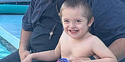 Nova joined the competition — help win amazing prizes! adult, barefoot, beaded_necklace, bonding, casual, child, family, greenery, happy, outdoor, person, plaid, pool, relaxation, shirt, shorts, sitting, smile, sunlight, water