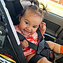 Anna Liz Falcon is registered to the contest to win money with this photo: baby, car_interior, car_seat, cherry_pattern, child, cute, hair_ties, happy, infant, orange_socks, pink_clothing, playful, pony_tails, portrait, safety_harness, seatbelt, secured, sitting, smiling, young_child
