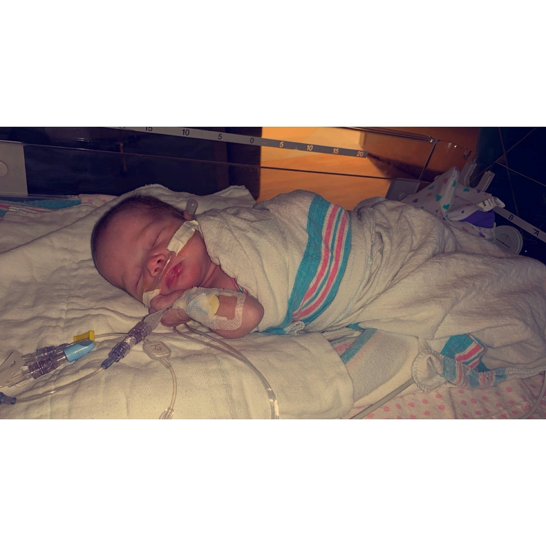 Mallory is registered to the contest to win money with this photo: baby, baby_sleeping, bed, bedding, child, comfort, event, eyewear, flesh, happy, hat, linens, love, medical, metal, nap, patient, person, service, sleeve