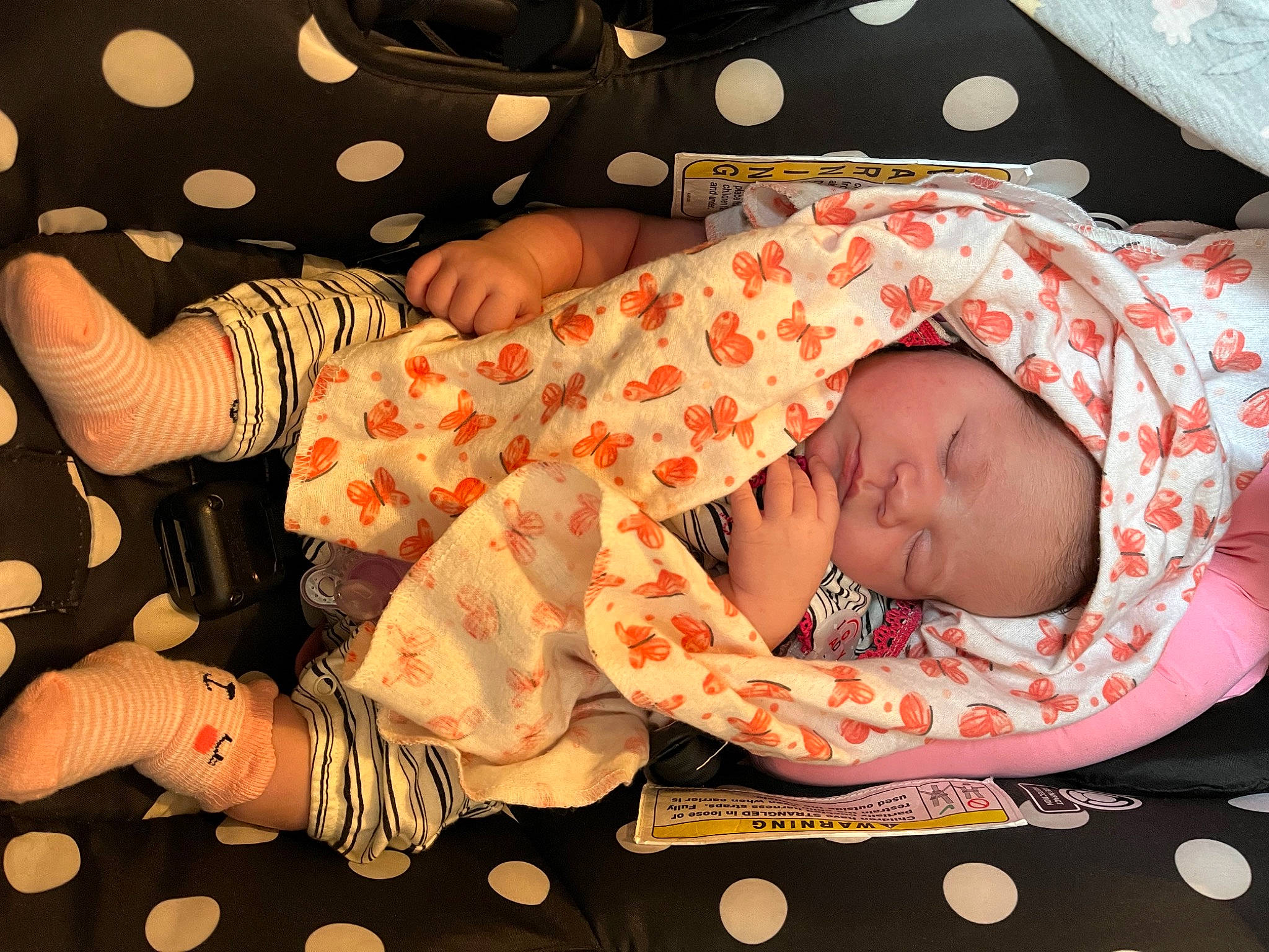 Aniya is registered to the contest to win money with this photo: arm, baby, baby_products, baby_sleeping, baby_toddler_clothing, beauty, bedtime, black, child, comfort, event, finger, hand, happy, infant_bed, linens, orange, pattern, person, toddler