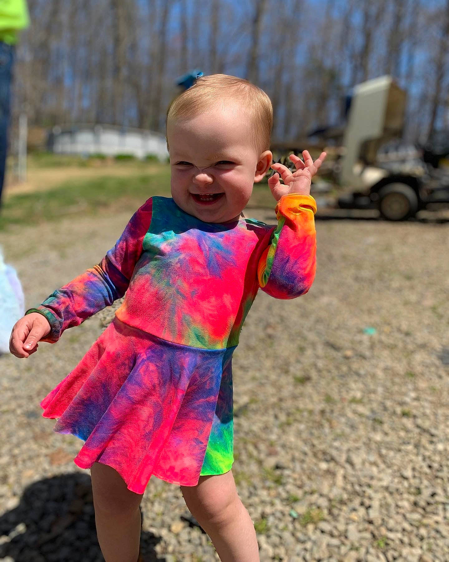 Clara is registered to the contest to win money with this photo: baby_toddler_clothing, face, fun, grass, happy, head, joy, leisure, magenta, people_in_nature, person, pink, recreation, skin, sky, sleeve, smile, summer, tire, toddler
