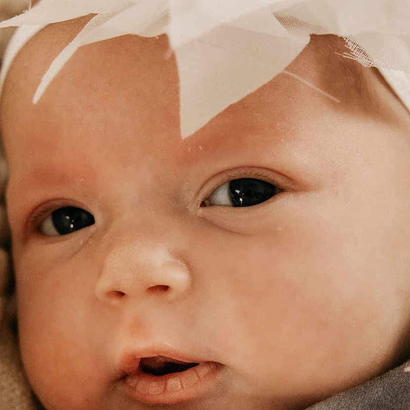 Bryleigh is registered to the contest to win money with this photo: baby, cheek, dress, eye, eyebrow, eyelash, face, finger, gesture, happy, head, headgear, iris, lip, mouth, nose, pink, skin, toddler, white
