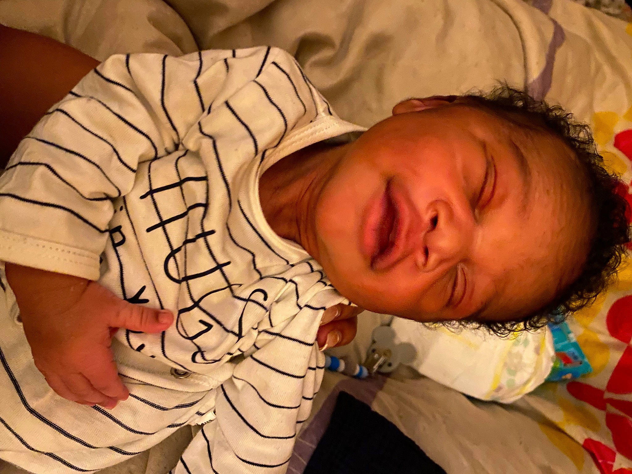 Kurtis participe au concours pour gagner de l'argent avec cette photo : baby_sleeping, child, comfort, eye, facial_expression, finger, gesture, happy, head, human, human_body, linens, mammal, mouth, neck, pattern, people, person, sleeve, textile