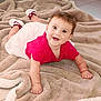 Cléorose a rejoint le concours — aidez-le/la à gagner de superbes lots ! baby, infant, smiling, lying_down, blanket, red_clothing, white_skirt, happy, cute, child, indoors, floor, toddler, young_child, portrait, face, person, skin, eyes, expression
